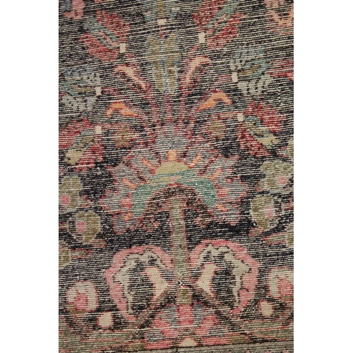 1014 - A PERSIAN WOOL RUNNER OR HALL CARPET dark blue ground with large floral design. 9ft 11ins x 3ft 8ins... 