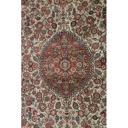 1019 - A GOOD PERSIAN SILK CARPET cream ground with floral decoration with a red ground border. Signed. 6ft... 