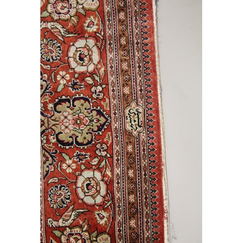 1019 - A GOOD PERSIAN SILK CARPET cream ground with floral decoration with a red ground border. Signed. 6ft... 