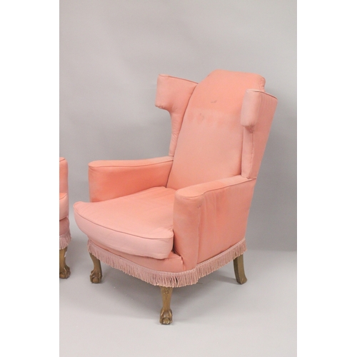 1022 - A PAIR OF PINK WING ARM CHAIRS on cabriole legs.