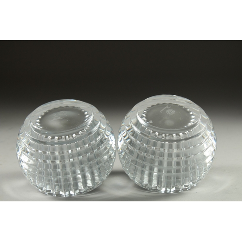 1057 - A SMALL PAIR OF BACCARAT CIRCULAR NIGHT LIGHTS. 3.5ins diameter, 2.5ins high. Signed in original box... 