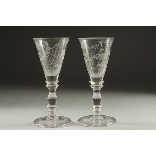 1061 - A GOOD PAIR OF WINE GLASSES engraved 