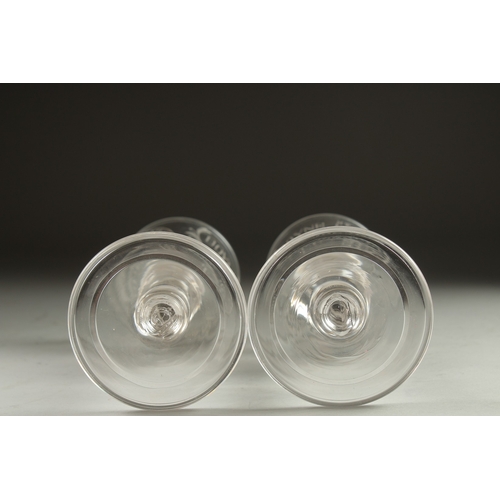 1061 - A GOOD PAIR OF WINE GLASSES engraved 