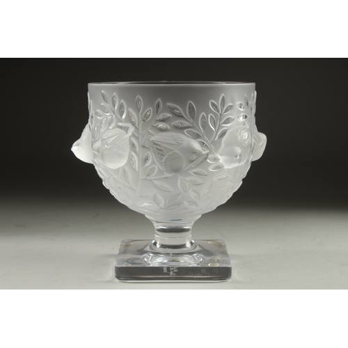 1064 - A LALIQUE FROSTED GLASS BOWL surrounded by chubby birds,  on a plain square base. Signed Lalique, Fr... 