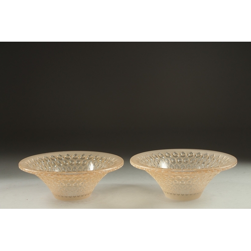 1065 - A PAIR OF COLOURED CIRCULAR LALIQUE BOWLS. Signed Lalique, France. 5.5ins deep.