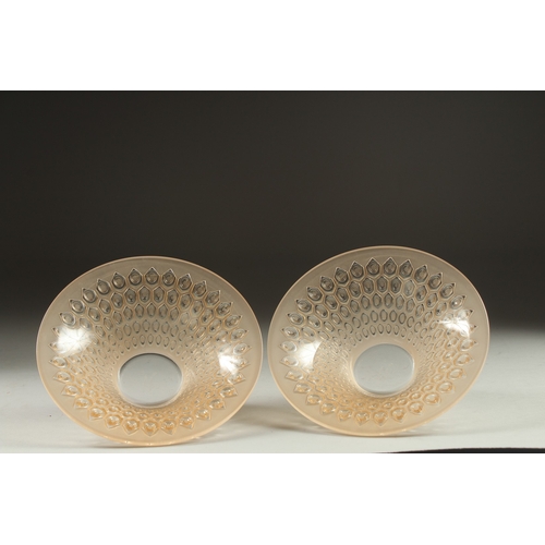 1065 - A PAIR OF COLOURED CIRCULAR LALIQUE BOWLS. Signed Lalique, France. 5.5ins deep.