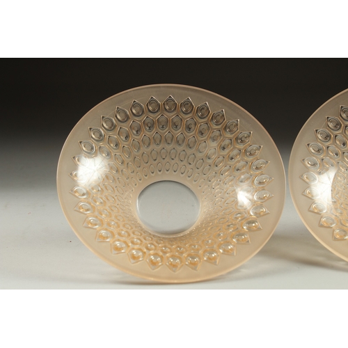 1065 - A PAIR OF COLOURED CIRCULAR LALIQUE BOWLS. Signed Lalique, France. 5.5ins deep.