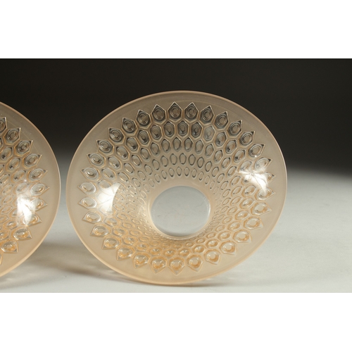 1065 - A PAIR OF COLOURED CIRCULAR LALIQUE BOWLS. Signed Lalique, France. 5.5ins deep.