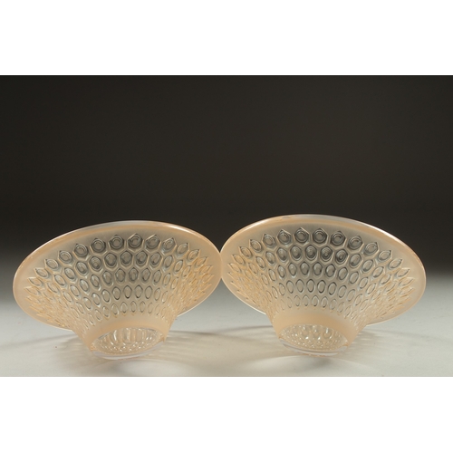 1065 - A PAIR OF COLOURED CIRCULAR LALIQUE BOWLS. Signed Lalique, France. 5.5ins deep.