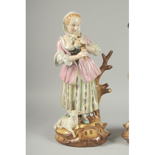 1086 - A LARGE PAIR OF PORCELAIN GROUPS OF A  GALLANT AND A YOUNG LADY, sheep at her feet. 16.5ins high.... 