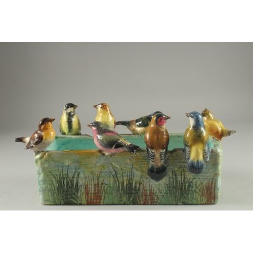 1096 - JEROME MASSIER A GOOD PORCELAIN RECTANGULAR JARDINIERE the sides with eight coloured birds. Signed o... 