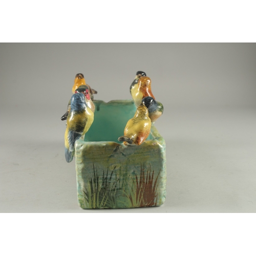 1096 - JEROME MASSIER A GOOD PORCELAIN RECTANGULAR JARDINIERE the sides with eight coloured birds. Signed o... 