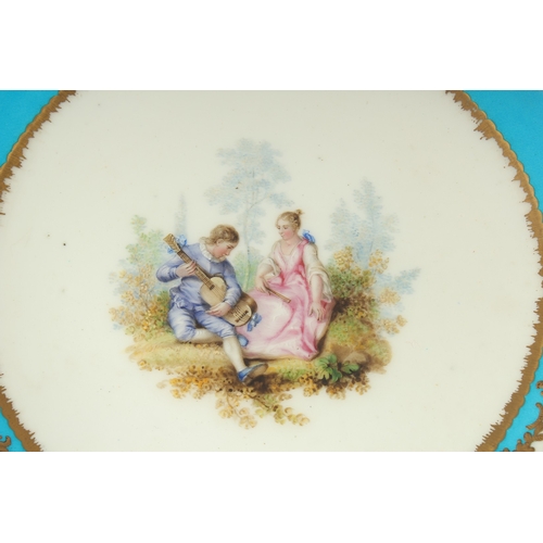 1097 - A PAIR OF  18TH CENTURY SEVRES CIRCULAR PORCELAIN PLATES, the blue borders decorated in gilt, with t... 