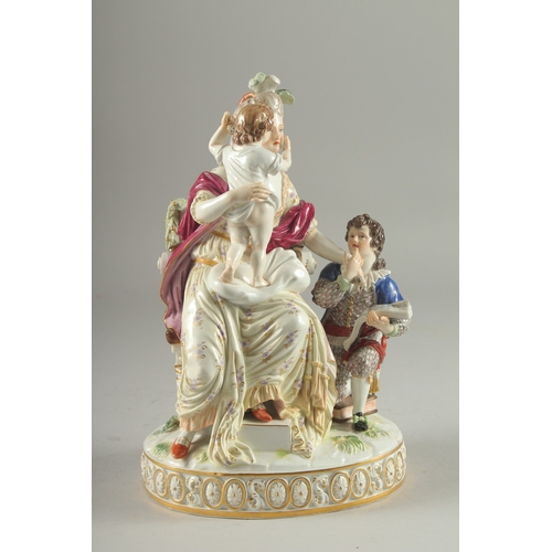 1098 - A VERY GOOD AND FINE 19TH CENTURY MEISSEN GROUP, a lady seated in a chair, a child on her lap, a you... 