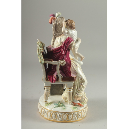 1098 - A VERY GOOD AND FINE 19TH CENTURY MEISSEN GROUP, a lady seated in a chair, a child on her lap, a you... 