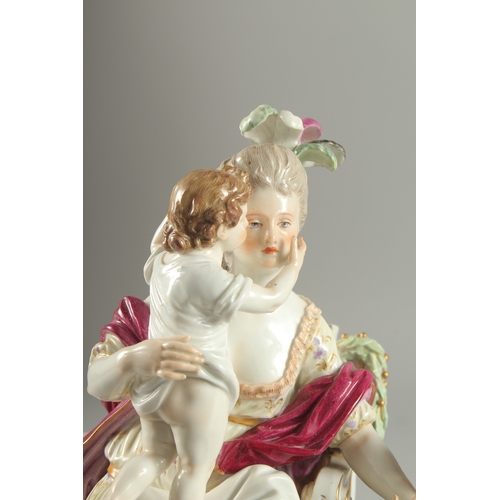 1098 - A VERY GOOD AND FINE 19TH CENTURY MEISSEN GROUP, a lady seated in a chair, a child on her lap, a you... 