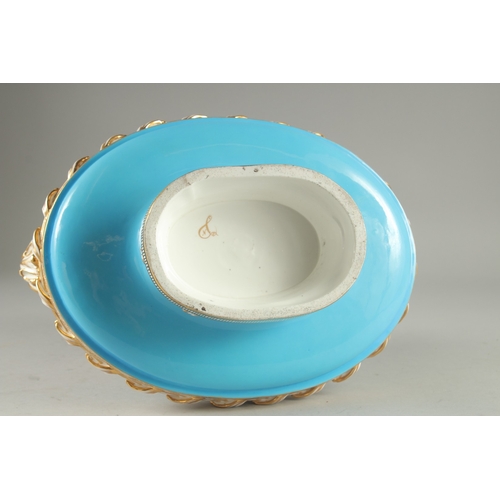 1099 - A SUPERB SEVRES DESIGN OVAL TUREEN AND COVER with pale blue ground edged in gilt, the sides with rev... 