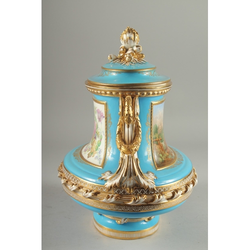 1099 - A SUPERB SEVRES DESIGN OVAL TUREEN AND COVER with pale blue ground edged in gilt, the sides with rev... 