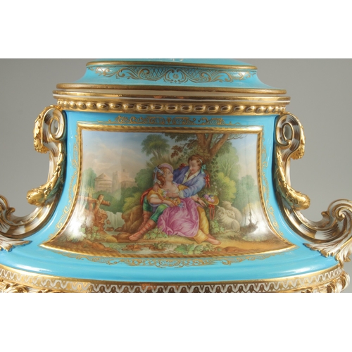 1099 - A SUPERB SEVRES DESIGN OVAL TUREEN AND COVER with pale blue ground edged in gilt, the sides with rev... 