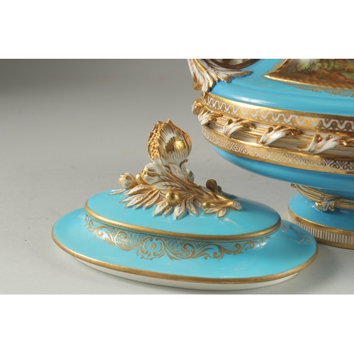 1099 - A SUPERB SEVRES DESIGN OVAL TUREEN AND COVER with pale blue ground edged in gilt, the sides with rev... 