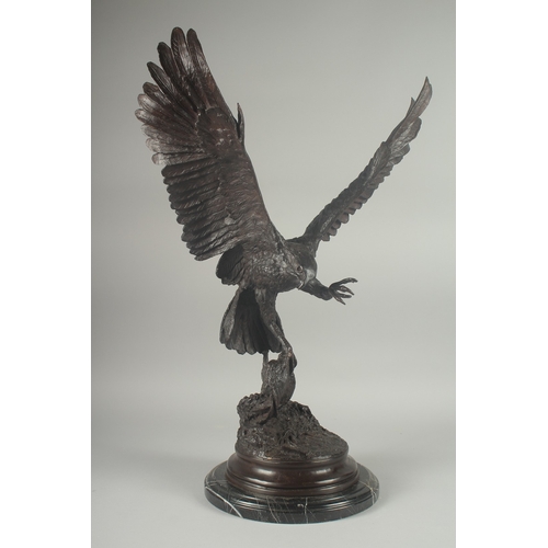 1101 - JULES MOIGNEZ (1815 - 1894). A SUPERB BRONZE OF AN EAGLE, WINGS OUTSTRETCHED with prey in it's claw.... 