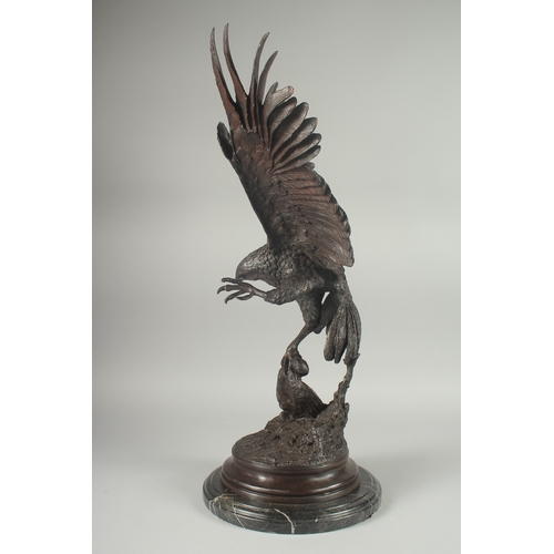 1101 - JULES MOIGNEZ (1815 - 1894). A SUPERB BRONZE OF AN EAGLE, WINGS OUTSTRETCHED with prey in it's claw.... 