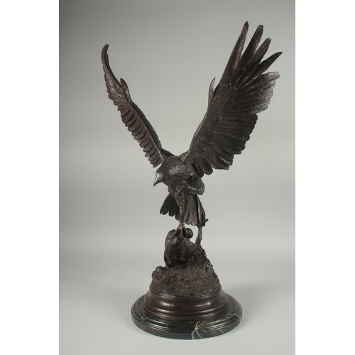 1101 - JULES MOIGNEZ (1815 - 1894). A SUPERB BRONZE OF AN EAGLE, WINGS OUTSTRETCHED with prey in it's claw.... 