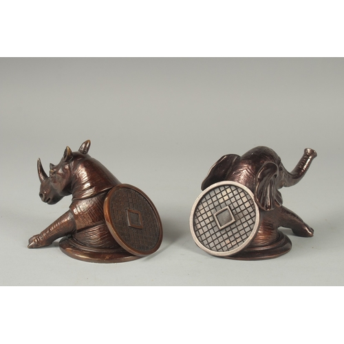 1111 - A PAIR OF DESK WEIGHTS, ELEPHANT AND RHINO.  4ins.