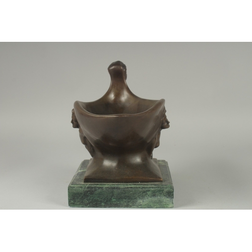 1122 - A BRONZE ABSTRACT OVAL BOWL on a marble base.