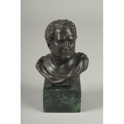 1123 - A BRONZE ROMAN MAN on a marble base.