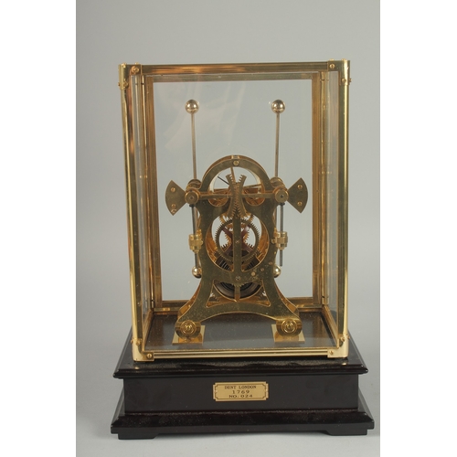 1131 - A GRASSHOPPER SKELETON CLOCK in a glass case.  13ins high overall.