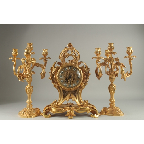 1133 - A GOOD LOUIS XVITH STYLE ORMOLU CLOCK GARNITURE the clock with Roman numerals and acanthus scrolls. ... 