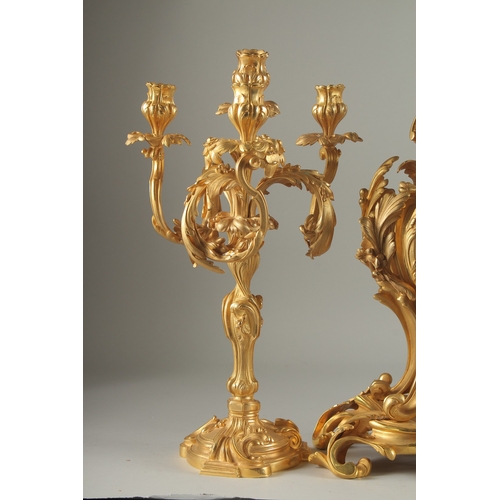 1133 - A GOOD LOUIS XVITH STYLE ORMOLU CLOCK GARNITURE the clock with Roman numerals and acanthus scrolls. ... 