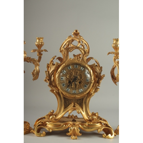 1133 - A GOOD LOUIS XVITH STYLE ORMOLU CLOCK GARNITURE the clock with Roman numerals and acanthus scrolls. ... 