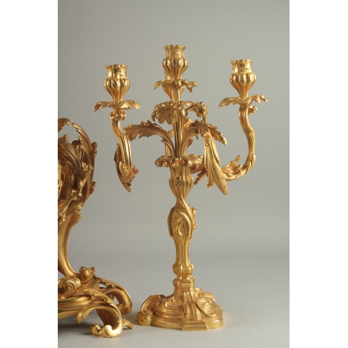 1133 - A GOOD LOUIS XVITH STYLE ORMOLU CLOCK GARNITURE the clock with Roman numerals and acanthus scrolls. ... 