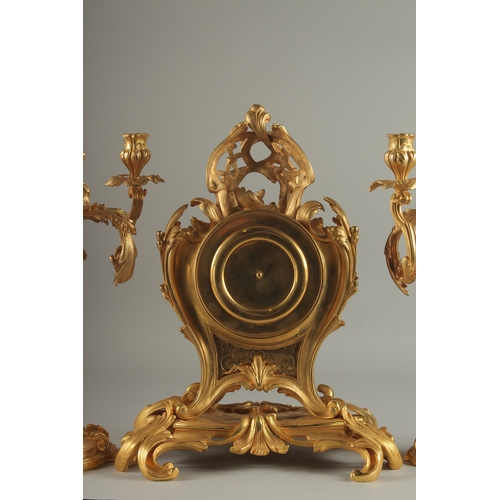 1133 - A GOOD LOUIS XVITH STYLE ORMOLU CLOCK GARNITURE the clock with Roman numerals and acanthus scrolls. ... 