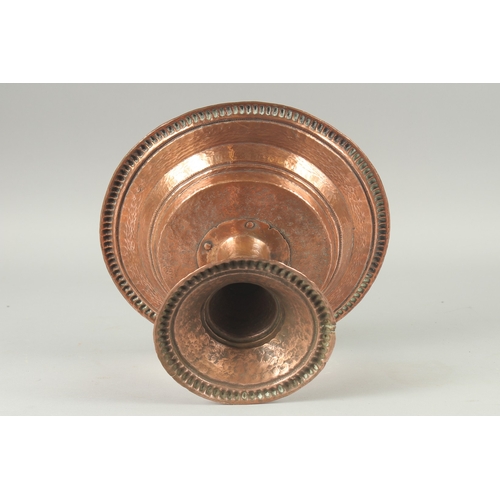 1136 - A TURKISH HAMMERED COPPER TAZZA. 11ins diameter, 6.5ins high.