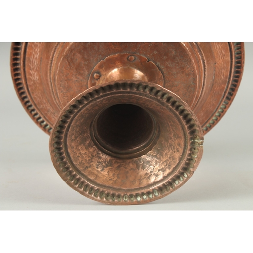 1136 - A TURKISH HAMMERED COPPER TAZZA. 11ins diameter, 6.5ins high.