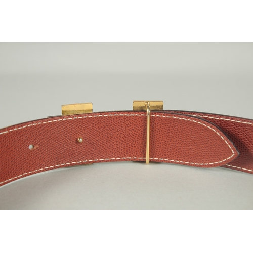 1376 - A HERMES LEATHER BELT. 35ins long.