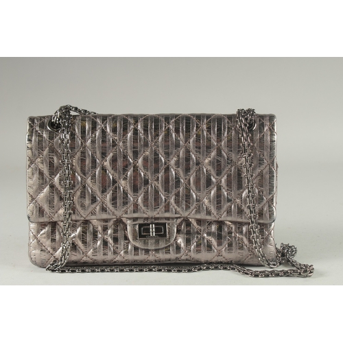 1381 - A VERY GOOD CHANEL METALLIC BRONZE PADDED HAND BAG. 10.8ins long, 8ins deep with a long entwined han... 