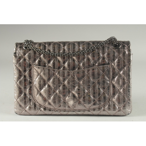 1381 - A VERY GOOD CHANEL METALLIC BRONZE PADDED HAND BAG. 10.8ins long, 8ins deep with a long entwined han... 