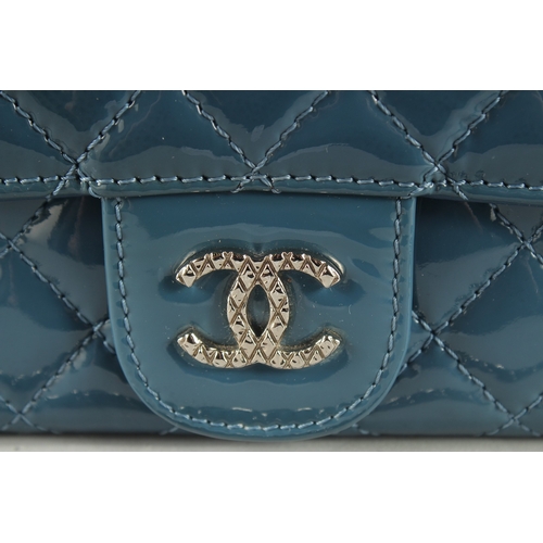 1382 - A VERY GOOD CHANEL BLUE PATENT LEATHER HAND BAG with double C medallion. 9.5ins long, 4.75ins deep w... 