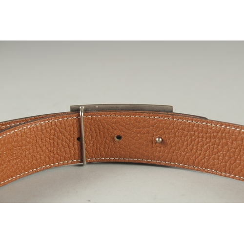 1384 - A BROWN LEATHER HERMES PARIS BELT.  36ins long.