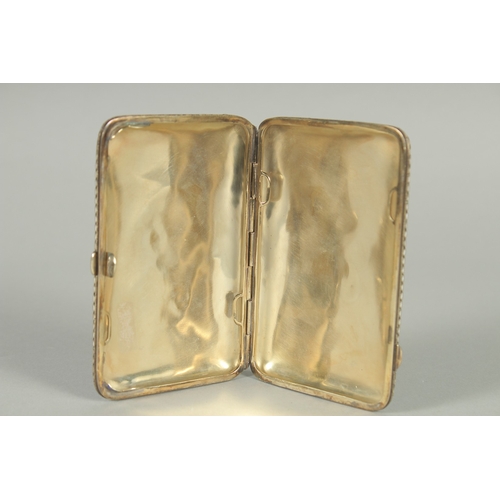 1404 - A RUSSIAN SILVER AND ENAMEL CIGARETTE CASE. 10cm x 6.5cm Weight: 119gms.