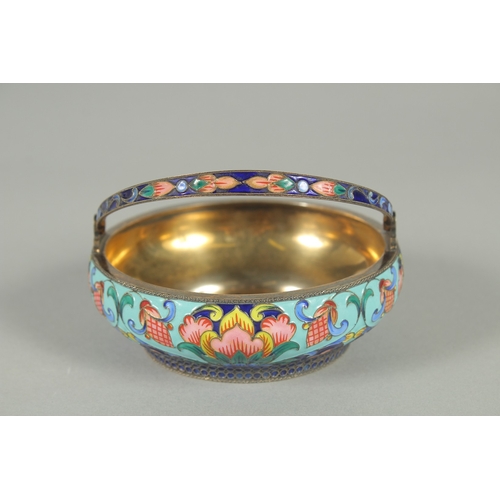 1406 - A RUSSIAN CIRCULAR SILVER AND ENAMEL SUGAR BASKET with swivel handles. 10.5cm diameter, 3.5cm deep. ... 