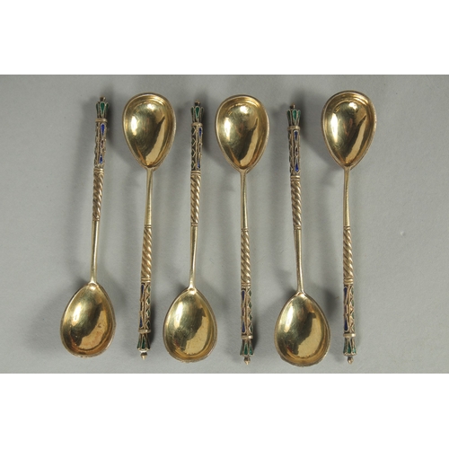 1418 - A SET OF SIX RUSSIAN SILVER AND ENAMEL SPOONS.  10.5cm long. Marks: 84. K.P. Weight: 60gms.