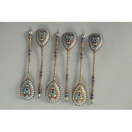 1419 - A SET OF SIX RUSSIAN SILVER AND ENAMEL SPOONS.  10cm long. Mark: Head. Weight: 40gms.