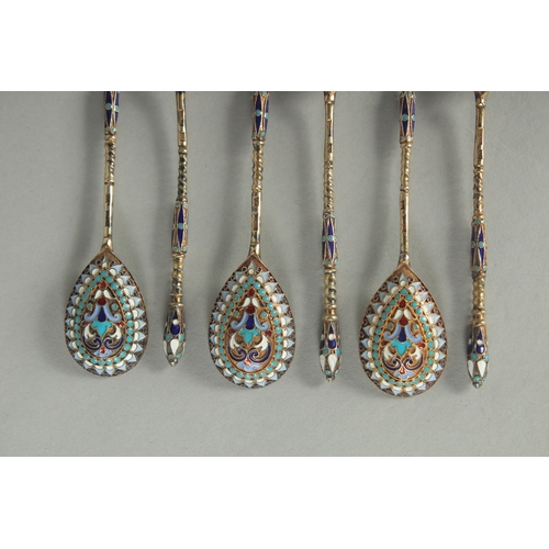 1419 - A SET OF SIX RUSSIAN SILVER AND ENAMEL SPOONS.  10cm long. Mark: Head. Weight: 40gms.