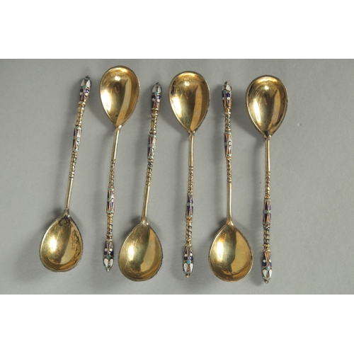 1419 - A SET OF SIX RUSSIAN SILVER AND ENAMEL SPOONS.  10cm long. Mark: Head. Weight: 40gms.