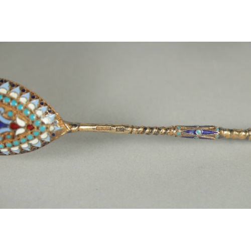 1419 - A SET OF SIX RUSSIAN SILVER AND ENAMEL SPOONS.  10cm long. Mark: Head. Weight: 40gms.